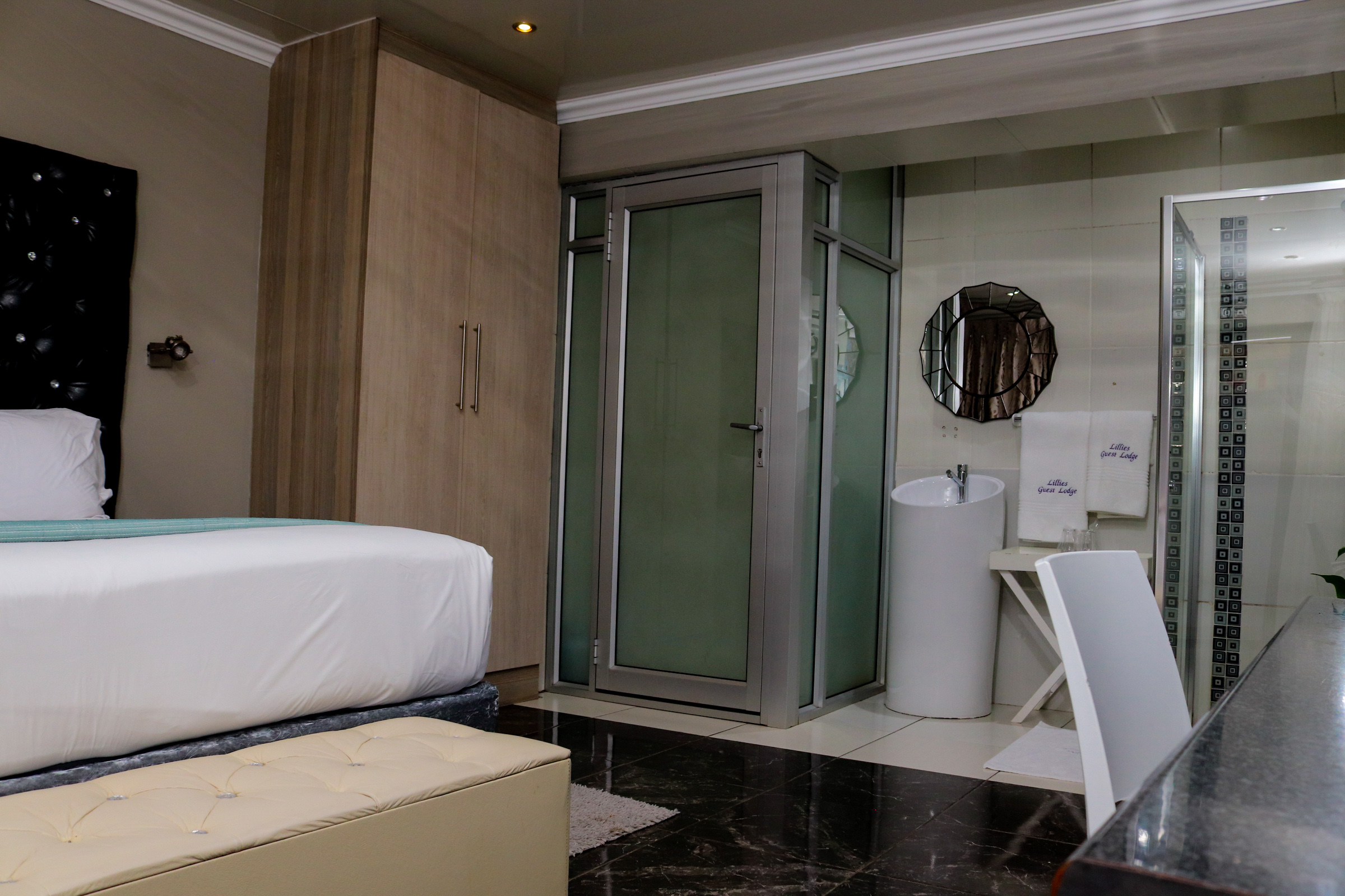 Lillies Guest Lodge guest room with bed
